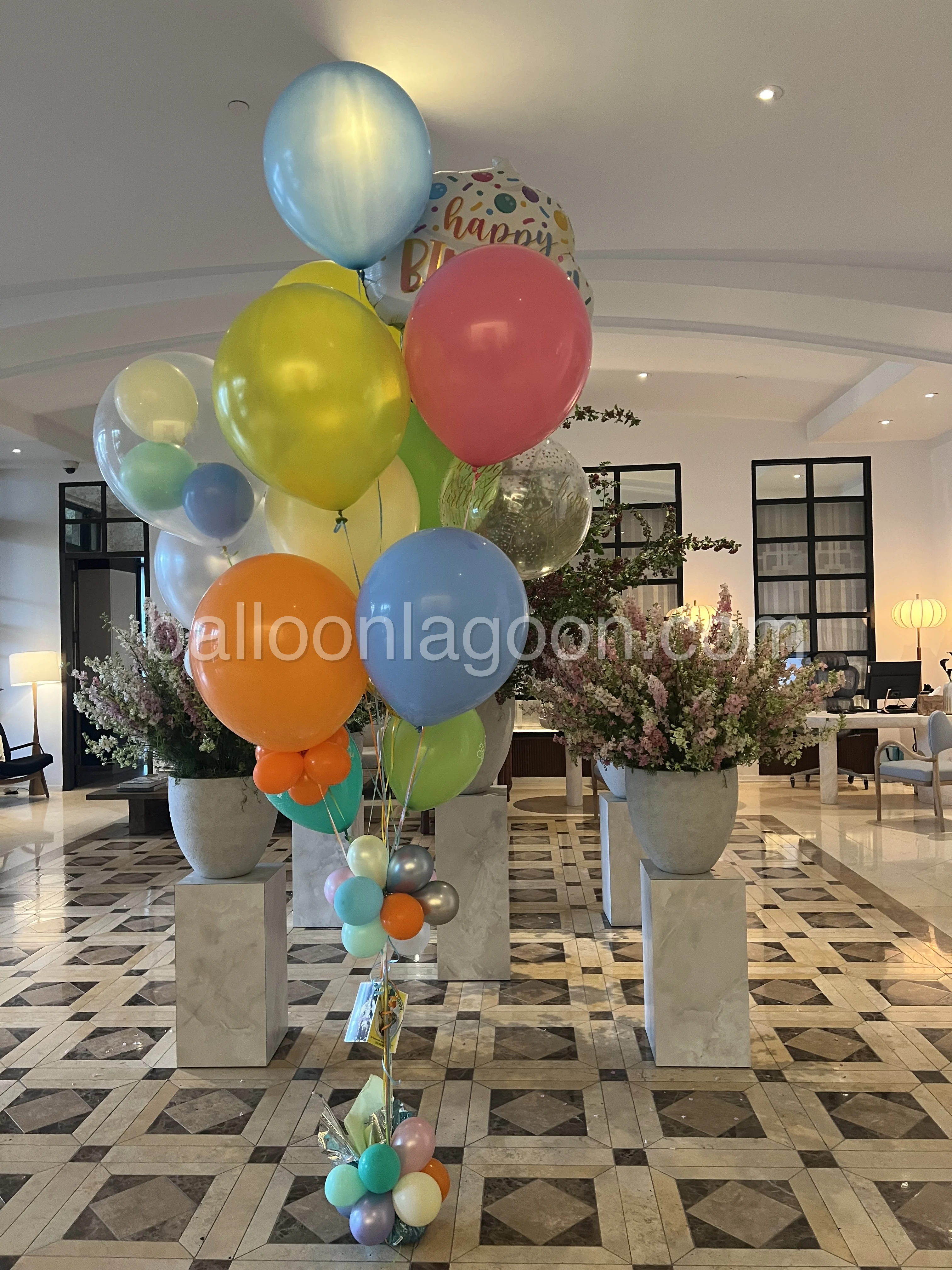 Colorful balloon promenade installation at a luxury event in Beverly Hills