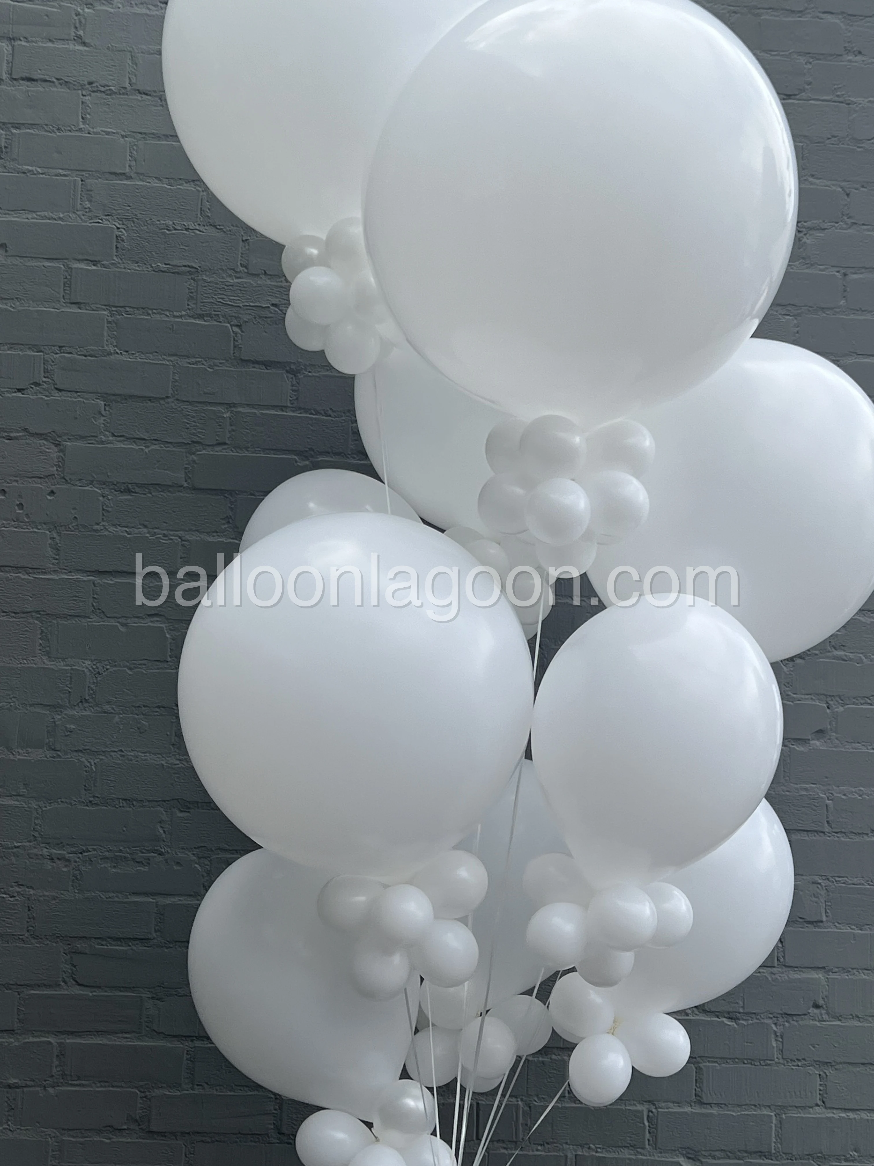 White organic eco-friendly balloon garland installation at a Los Angeles event